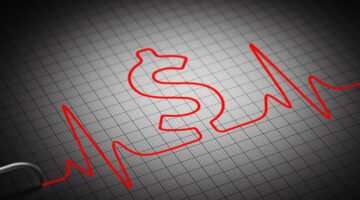 ECG. Сardiograph machine draw heartbeat motion and Dollar sign. Red cardiogram line with graph paper background. Business and money research concept healthcare dinance